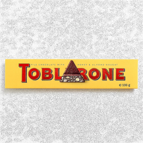 Toblerone <small>Toblerone milk chocolate with honey & almond 100gm</small>